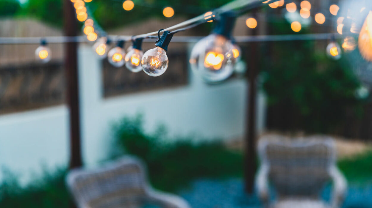 Bulb string lights hanging over a patio set